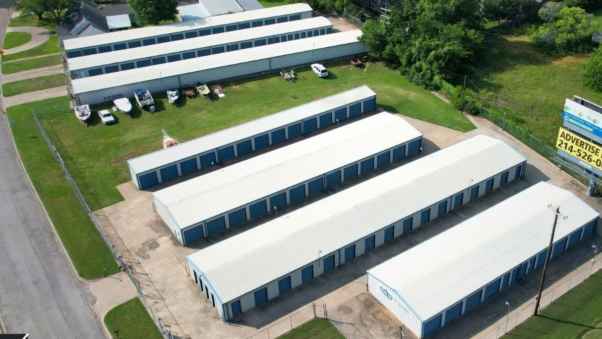 Aerial view of the gated storage facility with rows of drive-up units in Burleson, Texas