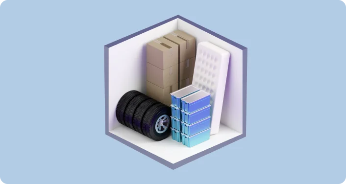 Small storage unit illustration holding boxes, tires, a mattress and plastic bins